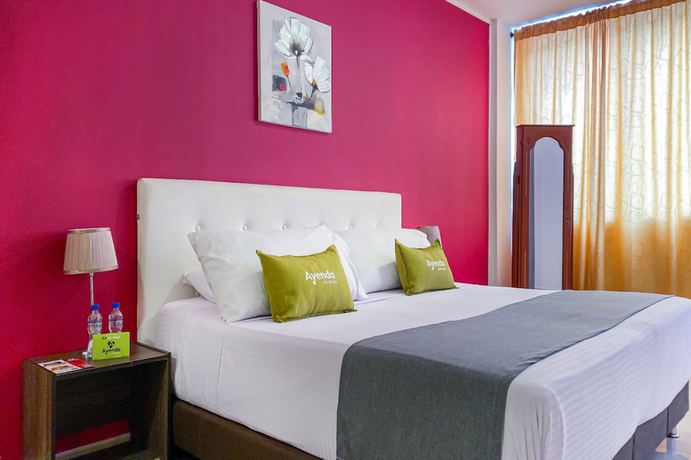 Imagen de la habitación del Hotel Suite Center Pereira. Foto 2