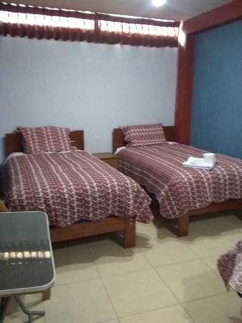 Imagen de la habitación del Hotel Suite Juliaca. Foto 10