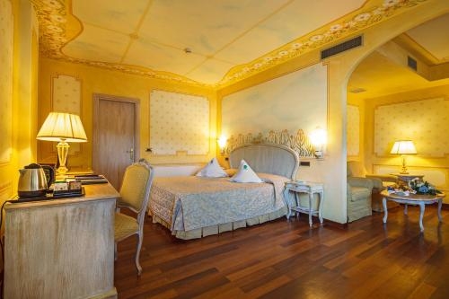 Imagen de la habitación del Hotel Suite Nettuno. Foto 10