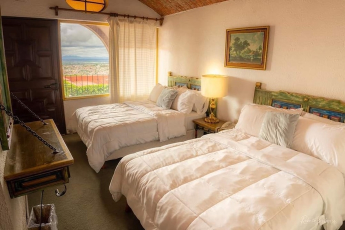 Imagen de la habitación del Hotel Suite vista hermosa. Foto 4