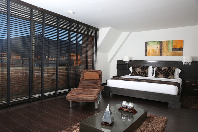 Imagen de la habitación del Hotel Suites 108. Foto 16