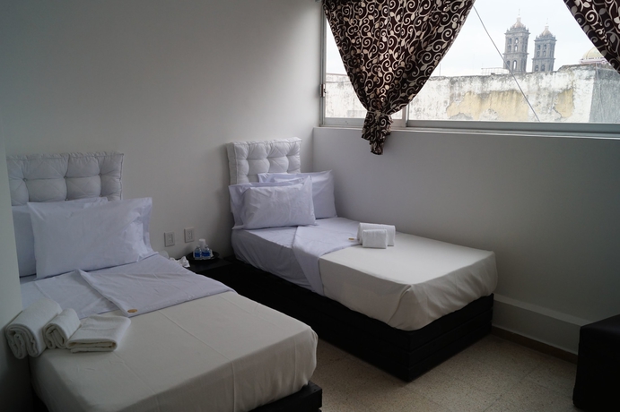 Imagen de la habitación del Hotel Suites 201. Foto 4