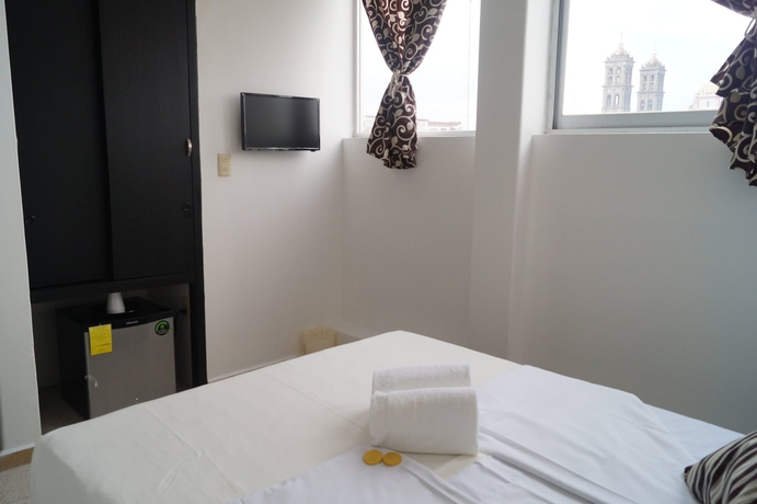 Imagen de la habitación del Hotel Suites 201. Foto 6