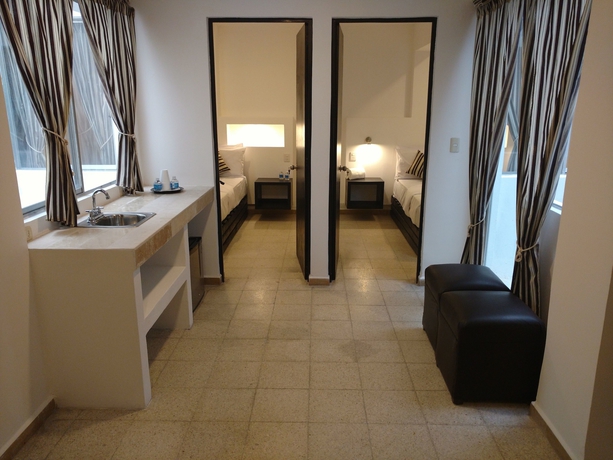 Imagen de la habitación del Hotel Suites 201. Foto 8