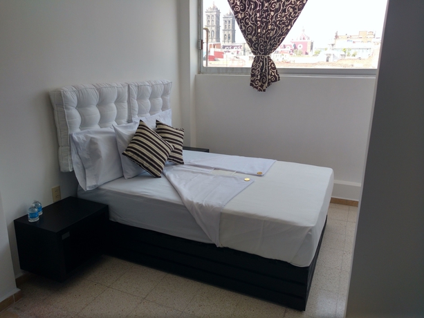 Imagen de la habitación del Hotel Suites 201. Foto 9