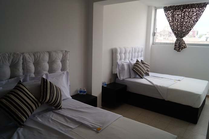 Imagen de la habitación del Hotel Suites 201. Foto 17