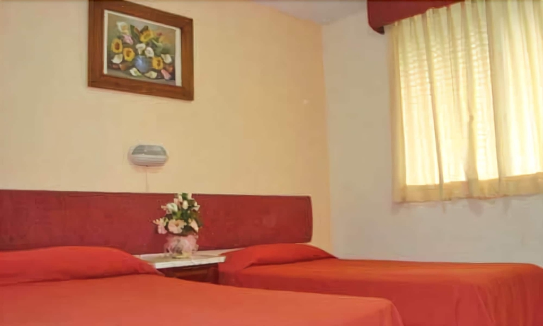 Imagen de la habitación del Hotel Suites Angelopolis. Foto 16