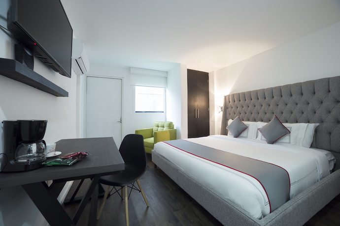 Imagen de la habitación del Hotel Suites Arboleda 215. Foto 3