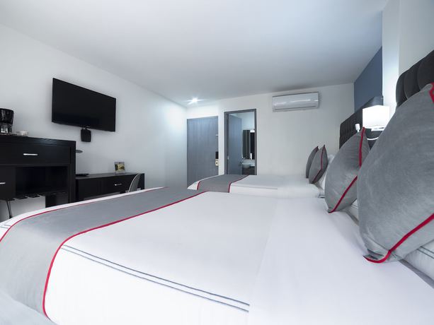 Imagen de la habitación del Hotel Suites Arboleda 215. Foto 8