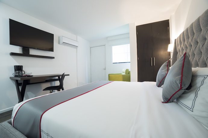 Imagen de la habitación del Hotel Suites Arboleda 215. Foto 10