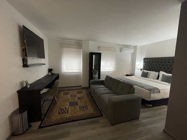 Imagen de la habitación del Hotel Suites Arboleda 215. Foto 12