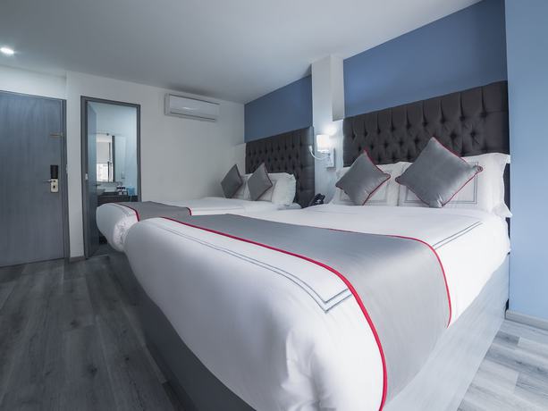 Imagen de la habitación del Hotel Suites Arboleda 215. Foto 14