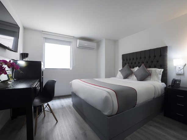 Imagen de la habitación del Hotel Suites Arboleda 215. Foto 17