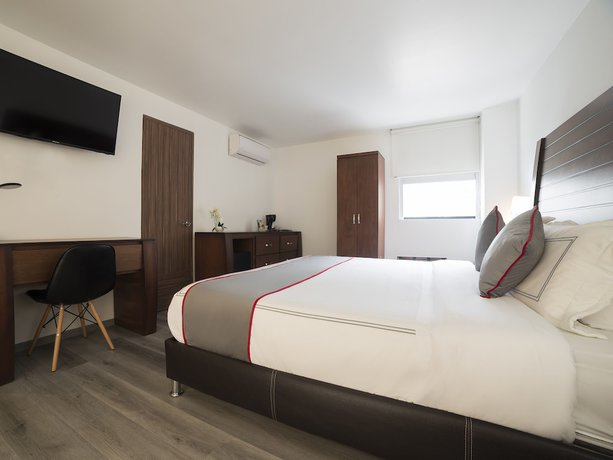 Imagen de la habitación del Hotel Suites Arboleda 215. Foto 18