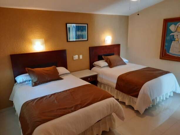 Imagen de la habitación del Hotel Suites Costa Dorada. Foto 18