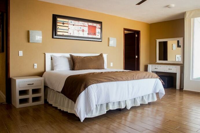 Imagen de la habitación del Hotel Suites Costa Dorada. Foto 19