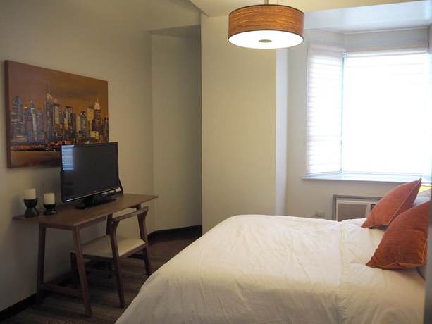 Imagen de la habitación del Hotel Suites De Marina Manila. Foto 7