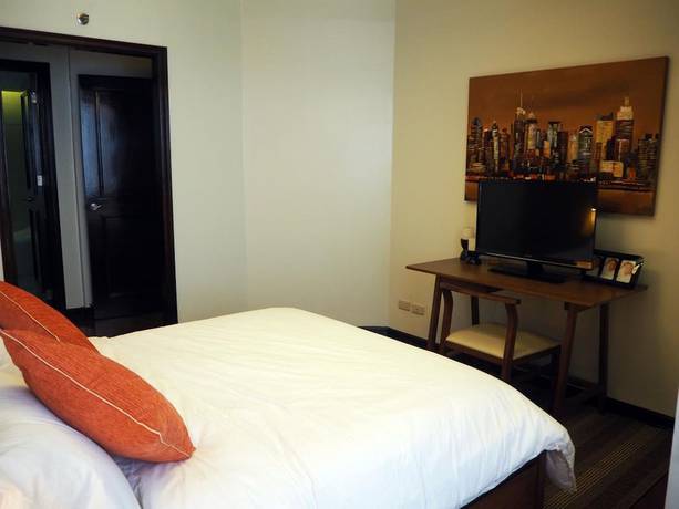 Imagen de la habitación del Hotel Suites De Marina Manila. Foto 10