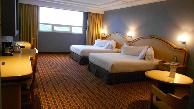 Imagen de la habitación del Hotel Suites Inn La Muralla Metepec. Foto 9