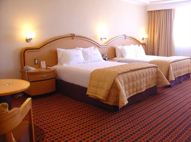 Imagen de la habitación del Hotel Suites Inn La Muralla Metepec. Foto 10