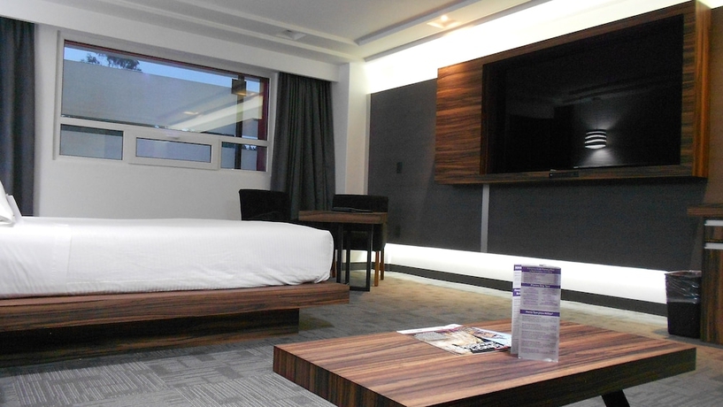 Imagen de la habitación del Hotel Suites Inn La Muralla Metepec. Foto 15
