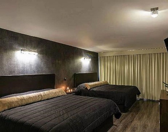 Imagen de la habitación del Hotel Suites Meson del Cid. Foto 9