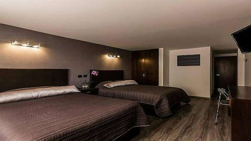 Imagen de la habitación del Hotel Suites Meson del Cid. Foto 11