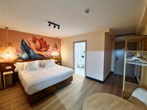 Imagen de la habitación del Hotel Suites Moma Centro. Foto 18