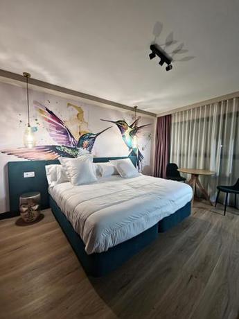 Imagen de la habitación del Hotel Suites Moma Centro. Foto 19