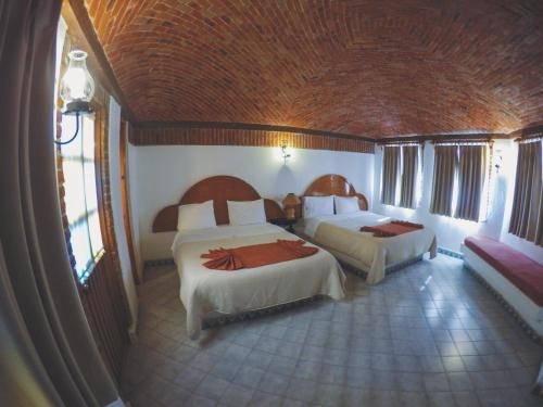Imagen de la habitación del Hotel Suites Paraiso Tx. Foto 9