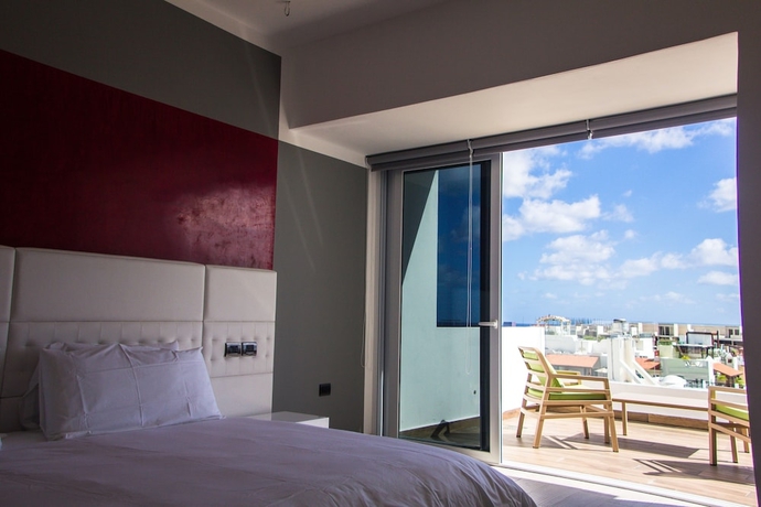 Imagen de la habitación del Hotel Suites Quinto Sol - Near Mamitas Beach Club. Foto 2