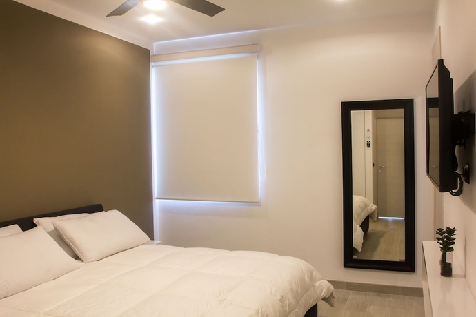 Imagen de la habitación del Hotel Suites Quinto Sol - Near Mamitas Beach Club. Foto 6