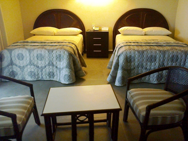 Imagen de la habitación del Hotel Suites Sina Cancún. Foto 6