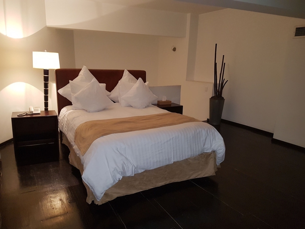 Imagen de la habitación del Hotel Suites Teca Once. Foto 8