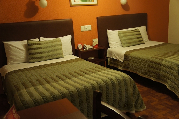 Imagen de la habitación del Hotel Suites Teziutlan. Foto 2