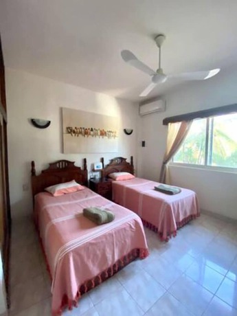Imagen de la habitación del Hotel Suites Ximajo. Foto 16