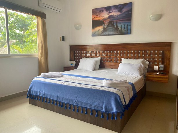 Imagen de la habitación del Hotel Suites Ximajo. Foto 17