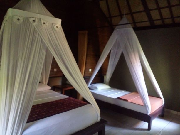 Imagen de la habitación del Hotel Suka Sari Cottages. Foto 8