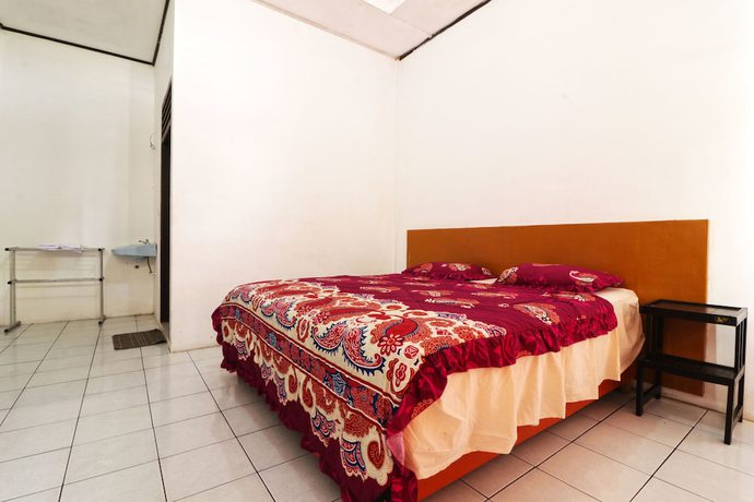 Imagen de la habitación del Hotel Sumber Pulo Mas. Foto 15