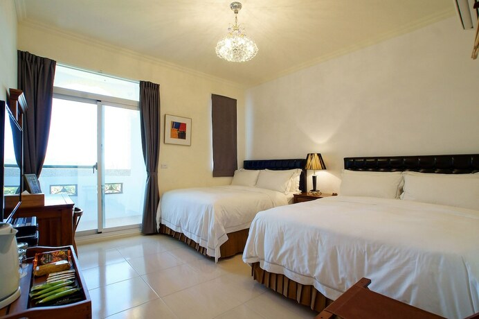 Imagen de la habitación del Hotel Summer Moonlight Vacation House. Foto 19