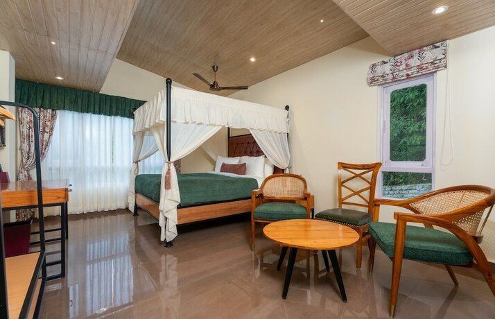 Imagen de la habitación del Hotel Summit Bougainvillea Tea Resort. Foto 8