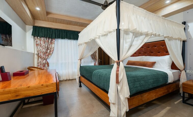 Imagen de la habitación del Hotel Summit Bougainvillea Tea Resort. Foto 12