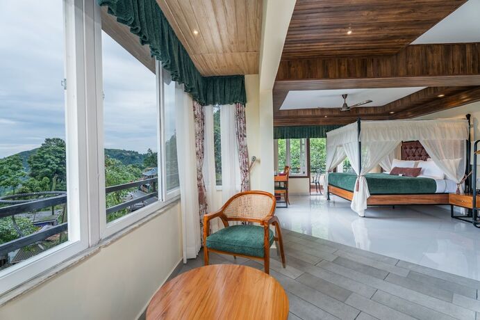 Imagen de la habitación del Hotel Summit Bougainvillea Tea Resort. Foto 13