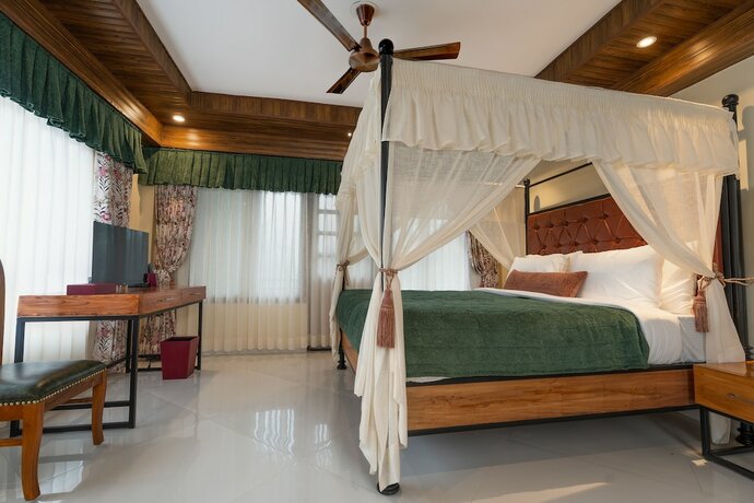 Imagen de la habitación del Hotel Summit Bougainvillea Tea Resort. Foto 16