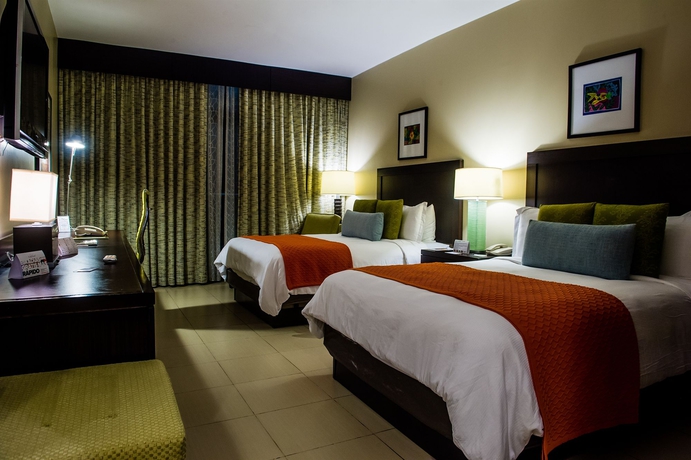 Imagen de la habitación del Hotel Summit Rainforest and Golf Resort. Foto 12