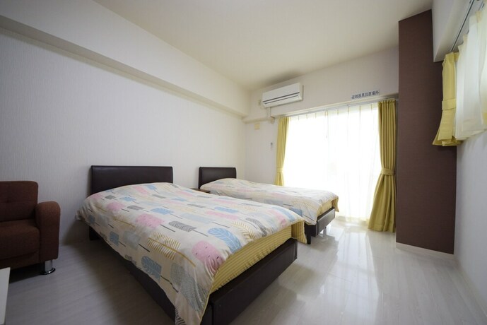 Imagen de la habitación del Hotel Sumuka Asato Station. Foto 15
