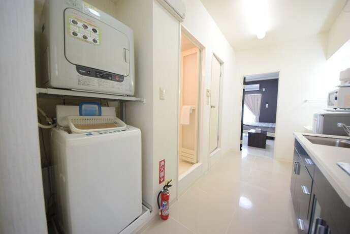 Imagen de la habitación del Hotel Sumuka Asato Station. Foto 34
