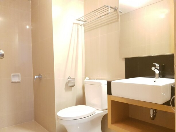 Imagen de la habitación del Hotel Sun Apartment Semarang. Foto 14