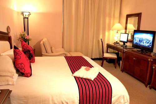 Imagen de la habitación del Hotel Sun City, HAIKOU. Foto 8