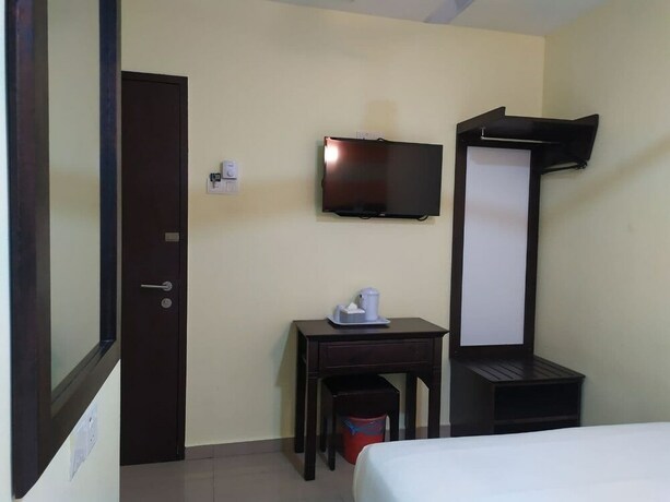 Imagen de la habitación del Hotel Sun Inns Meru Raya. Foto 12